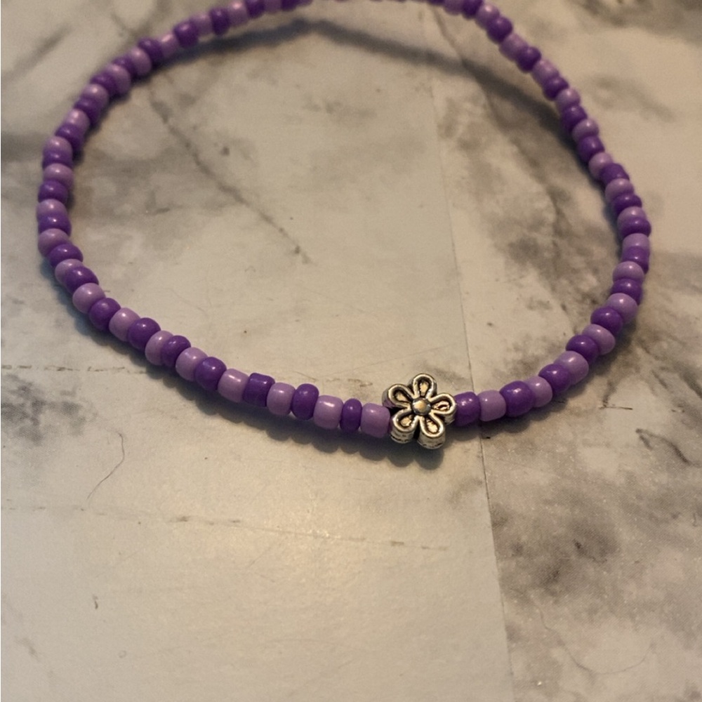 Purple Beaded Bracelet with Silver Flower Charm